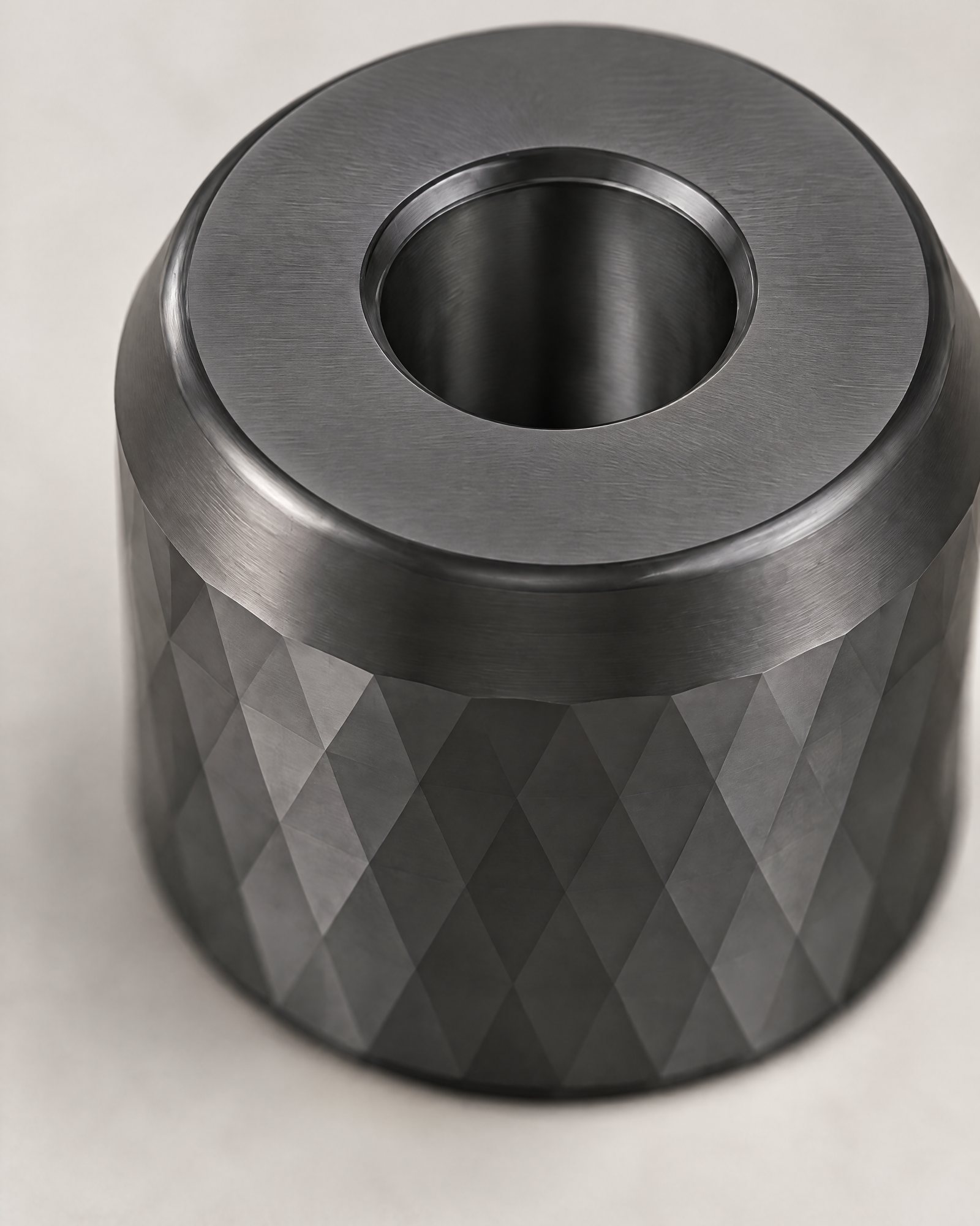 The facets and the top rim of the Razor Stand, Graphite, seen from above